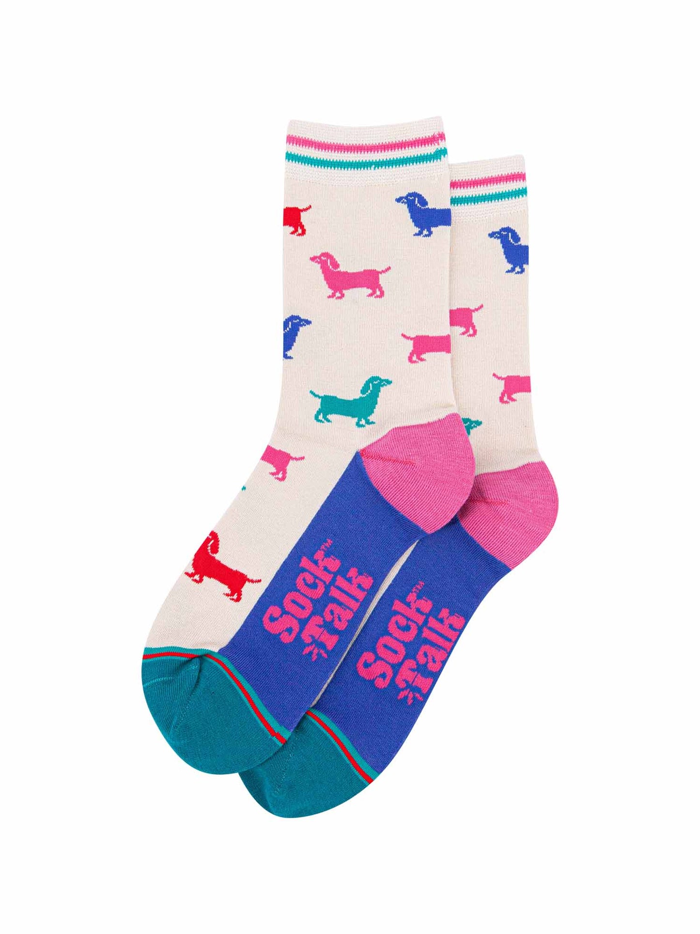 the pair of colourful sausage dog socks laying flat, one overlapping the other. showing clearly the cream background of the socks which is contrasted by colourful sausage dog silhouettes. the sock talk logo is visible on the base of the sole. 