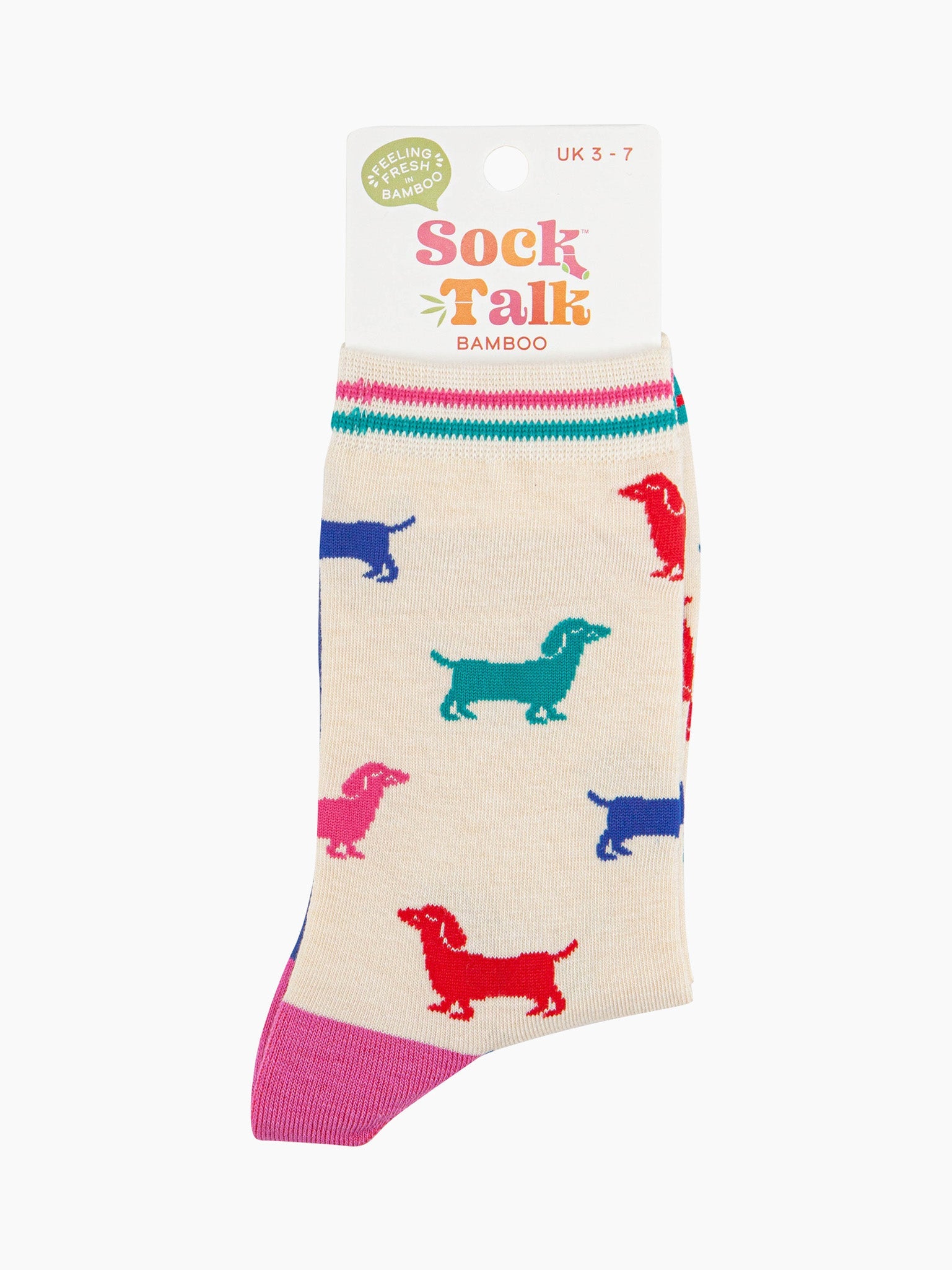 women's cream and multicoloured sausage dog ankle socks in their sock talk packaging, the socks are a uk size 3-7.