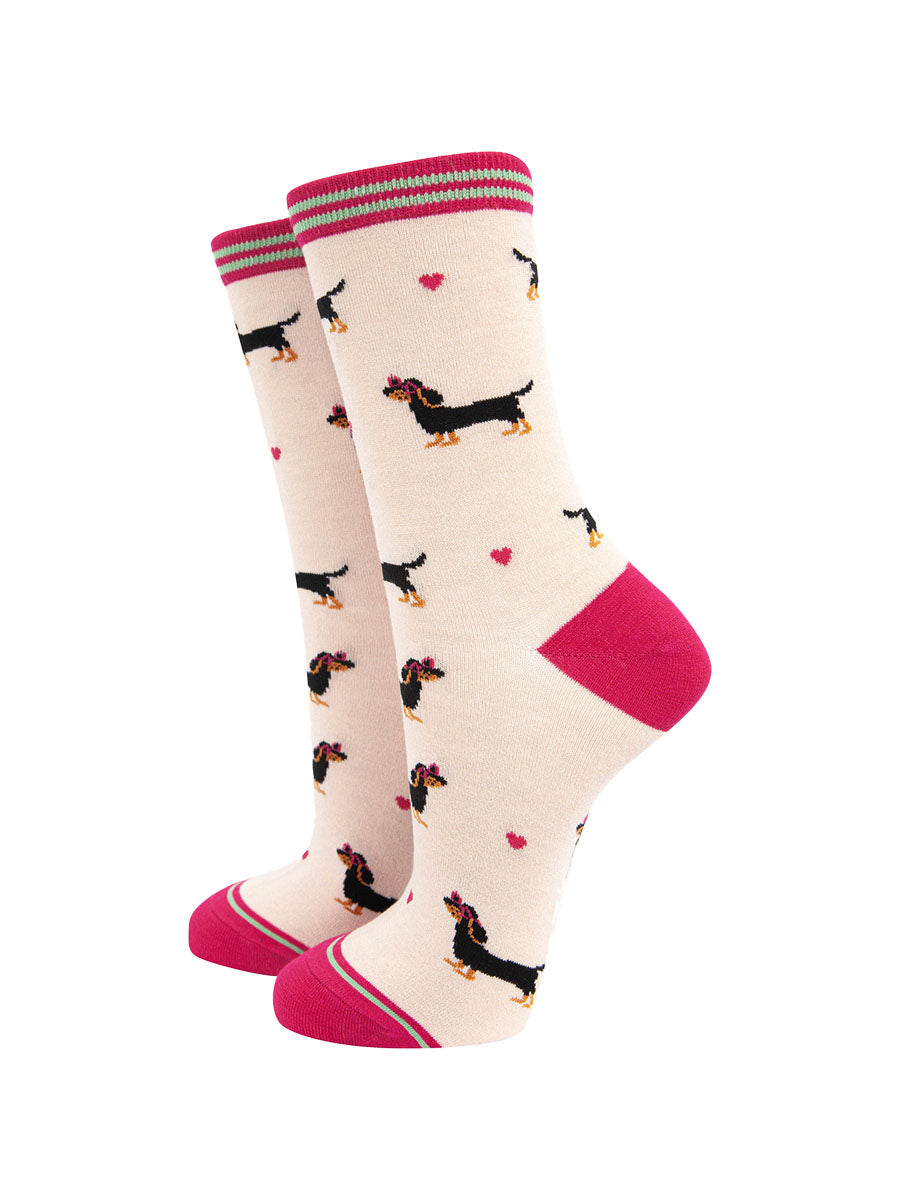 cream and pink bamboo ankle socks featuring a black miniature dachshund wearing pink love heart glasses