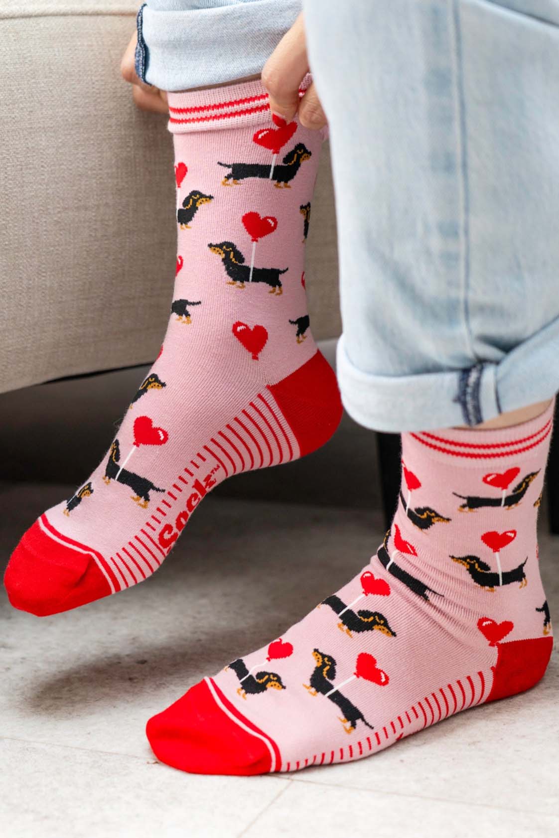 sausage-dog-print-bamboo-socks-in-pink-and-red