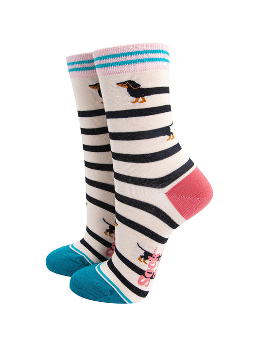 Winding-Sausage-Dog-Bamboo-Socks-in-Cream-On-Foot-Mannequin