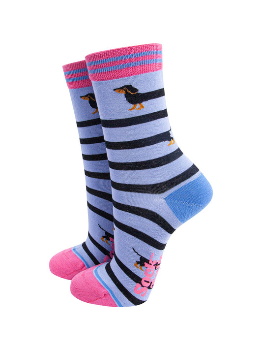 Winding-Sausage-Dog-Bamboo-Socks-in-Blue-On-Foot-Mannequin