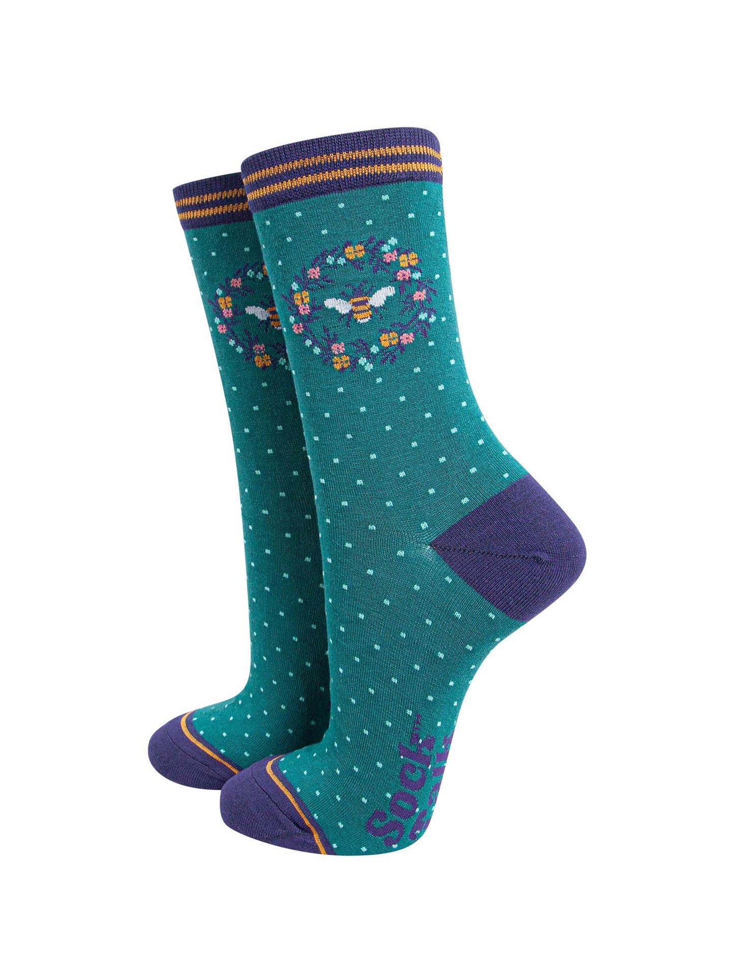 green and navy blue ankle socks featuring a large bumble bee in a floral wreath on the ankle