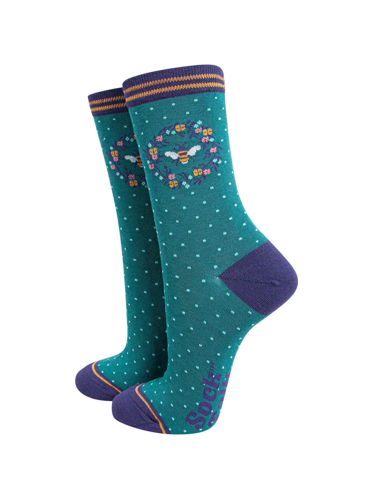 green and navy blue ankle socks featuring a large bumble bee in a floral wreath on the ankle