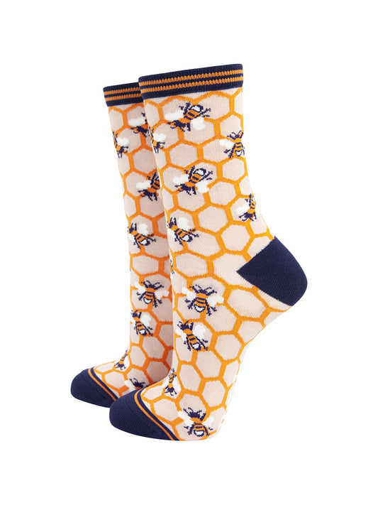 yellow and cream bamboo ankle socks with an all over yellow honeycomb pattern and scattered bees