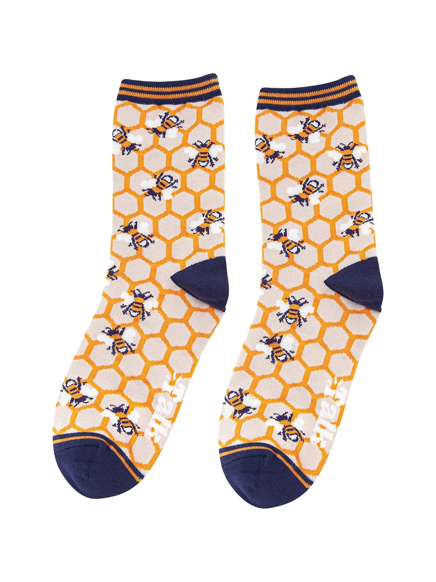 womens bees and honeycomb bamboo socks in yellow and navy blue with a striped cuff