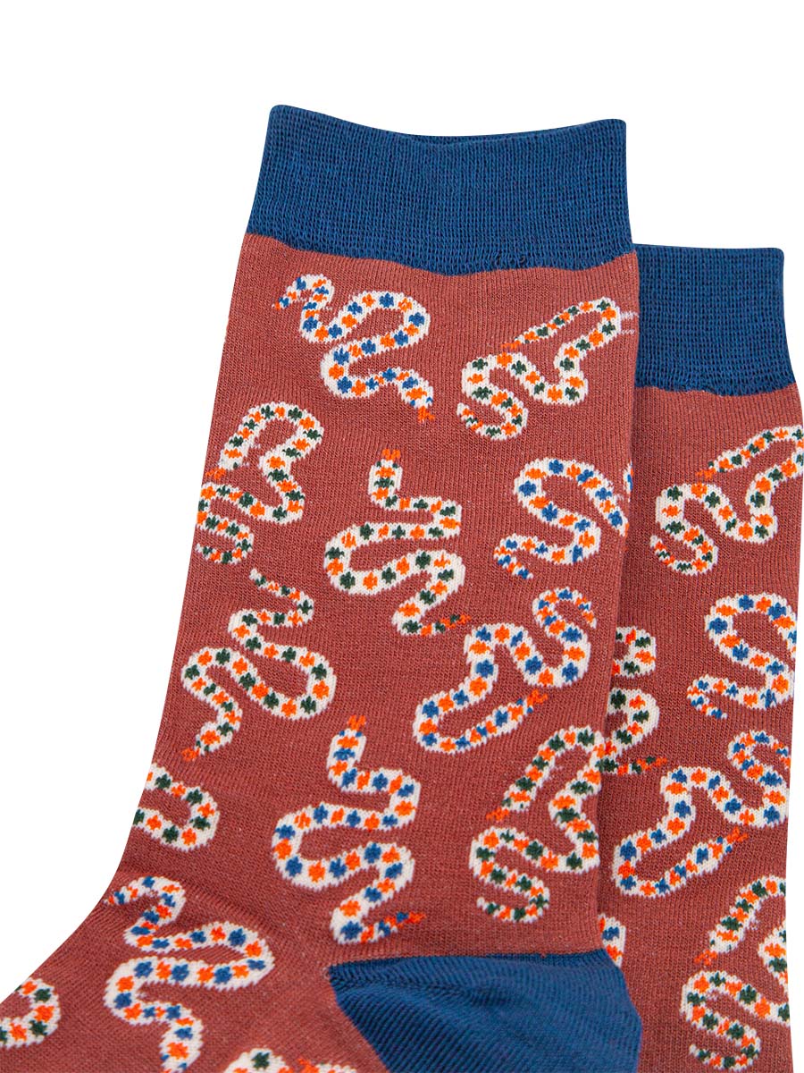 close up of the snake print patten on the mens dress socks