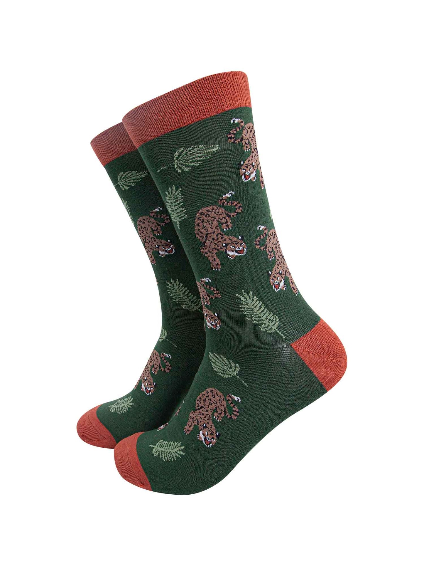 green and orange bamboo socks with an all over pattern featuring a prowling cheetah and jungle leaves