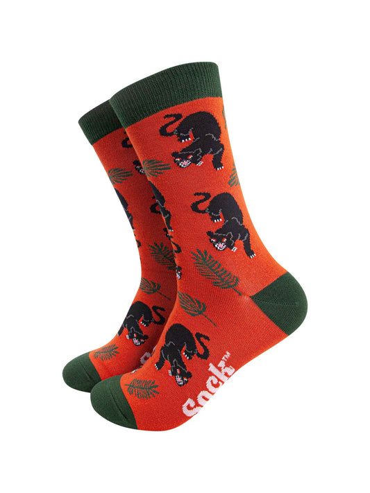 orange and green bamboo dress socks featuring a black panther big cat with a jungle leaf design