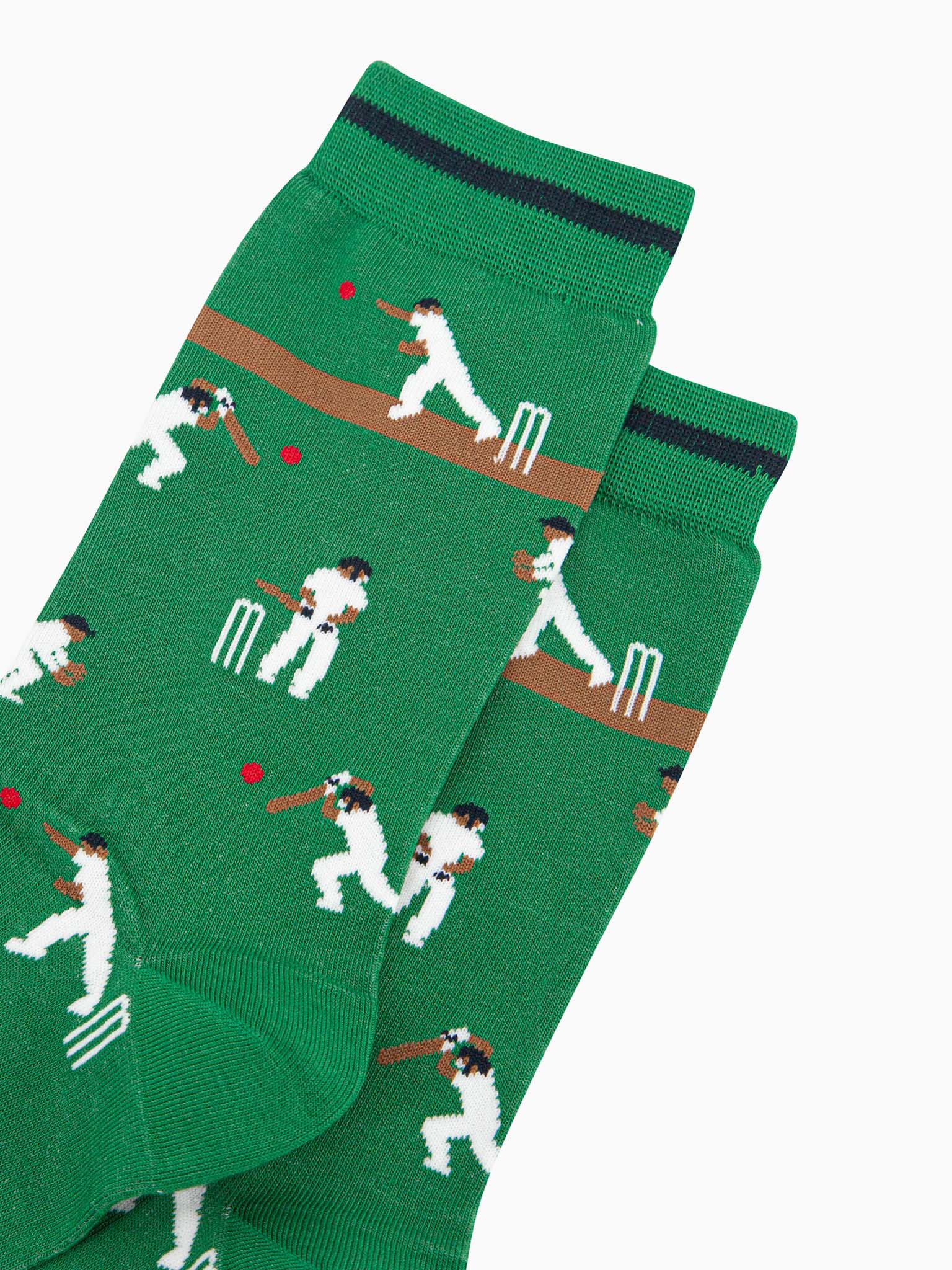 mens-bamboo-socks-green-cricket-players-close-up-cricketers-hitting-red-ball-white-wickets-running