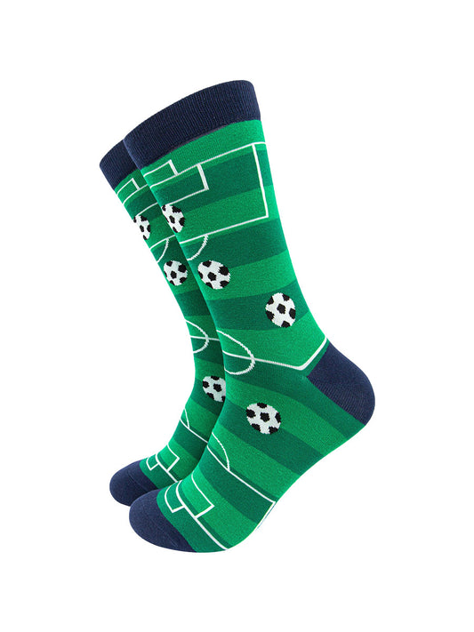 green socks designed to to look like a football pitch with black and white checked footballs