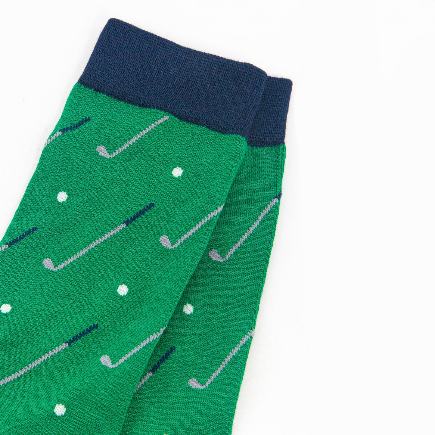 close up of the golf ball and golf club design on the socks