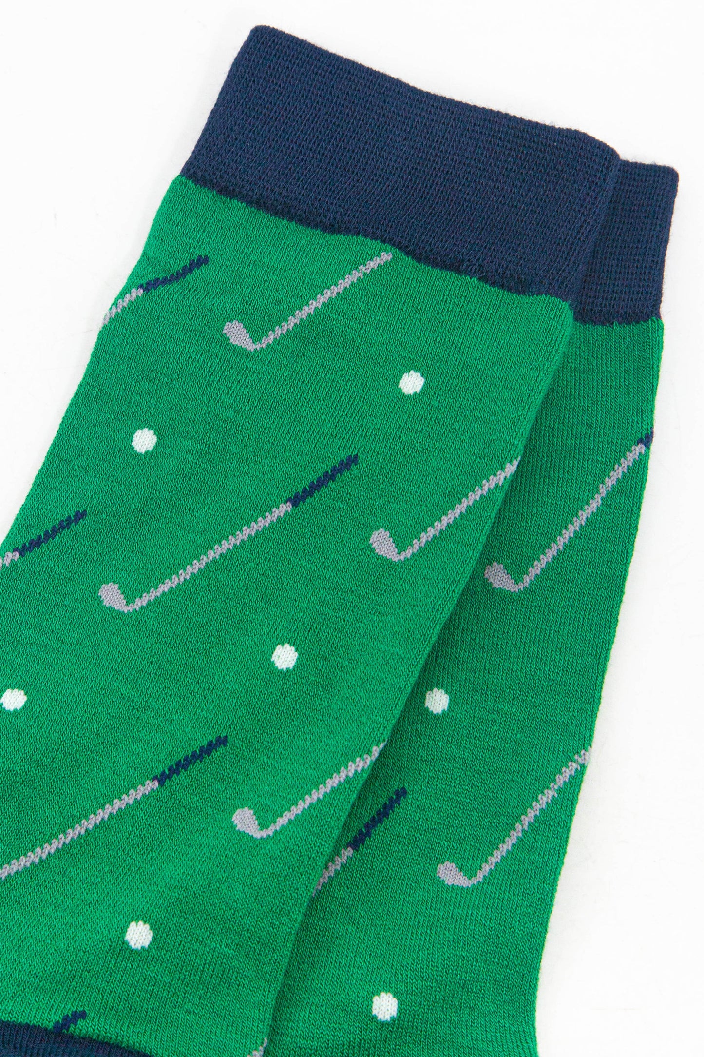 close up of the golf ball and golf club design on the socks