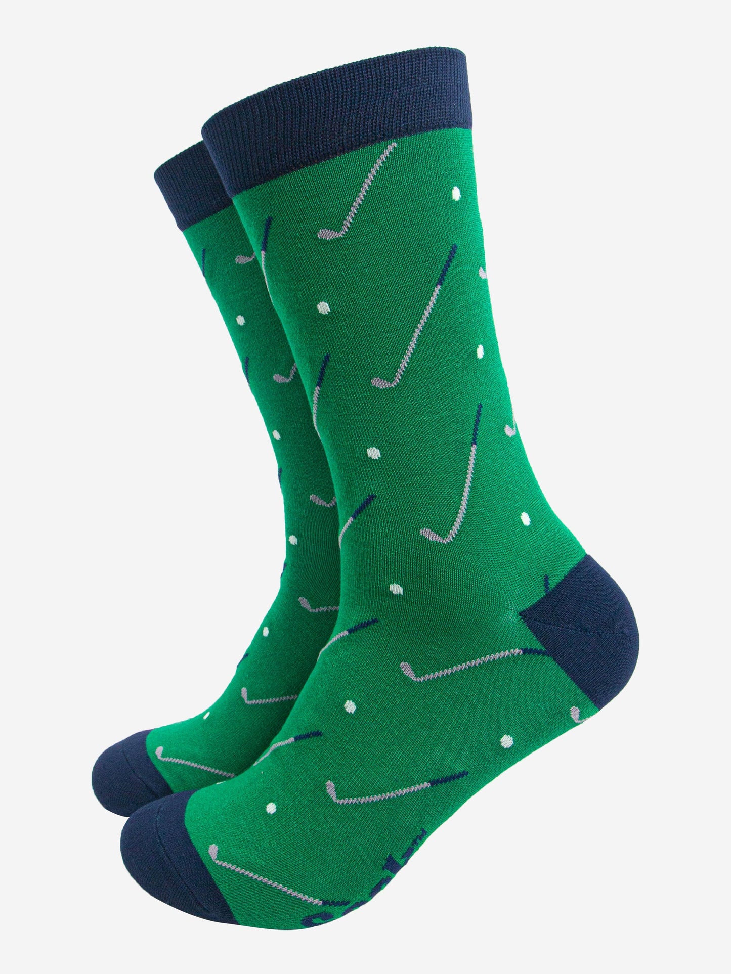 green dress socks with an all over pattern of golf balls and golf clubs