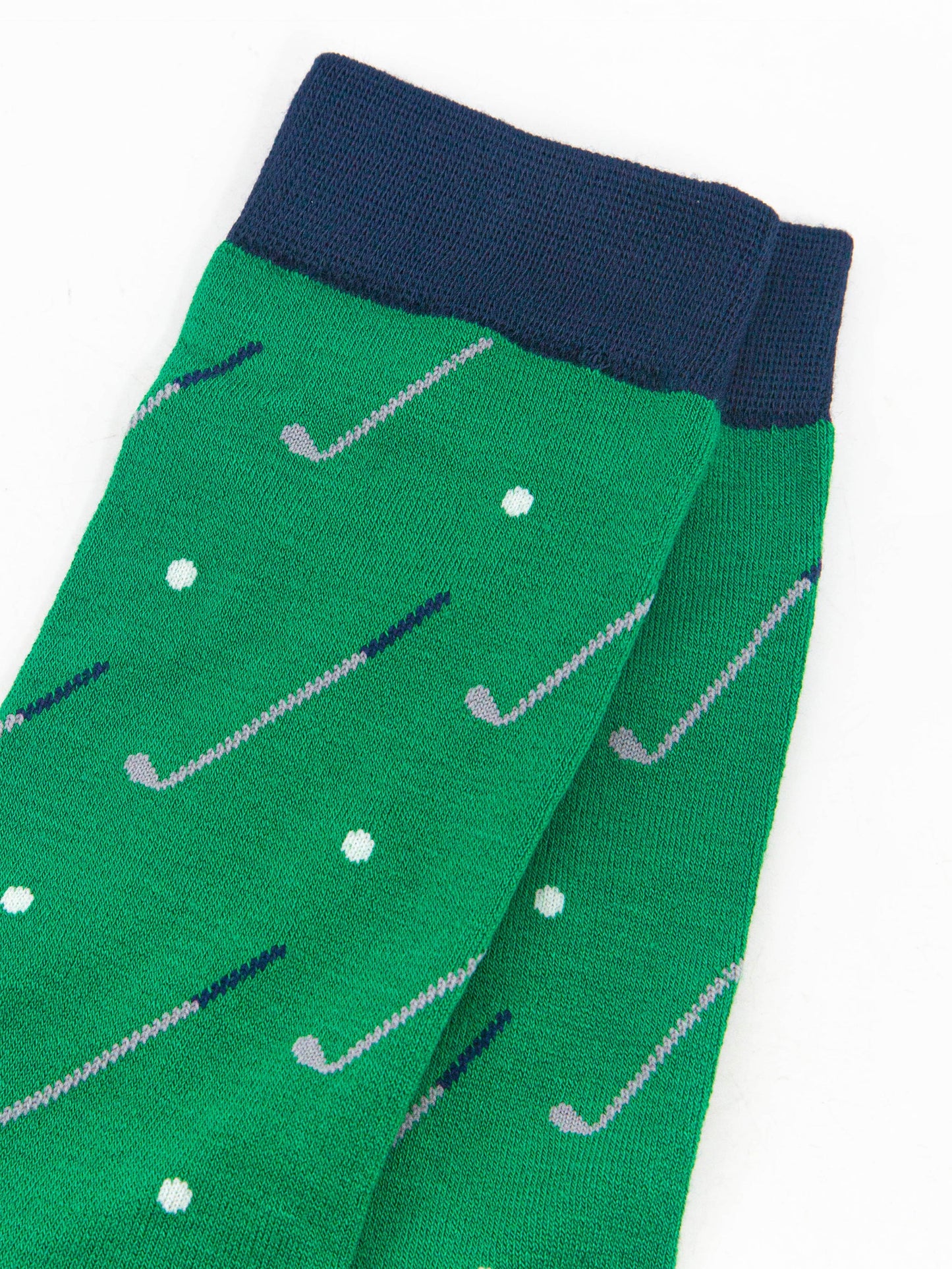 close up of the golf ball and golf club design on the socks