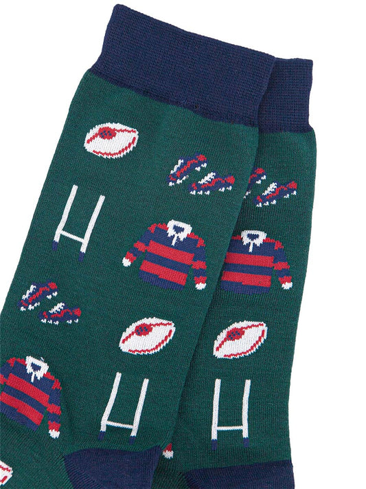 close up of the rugby goals, ball and red and blue striped rugby shirt pattern on the mens bamboo socks