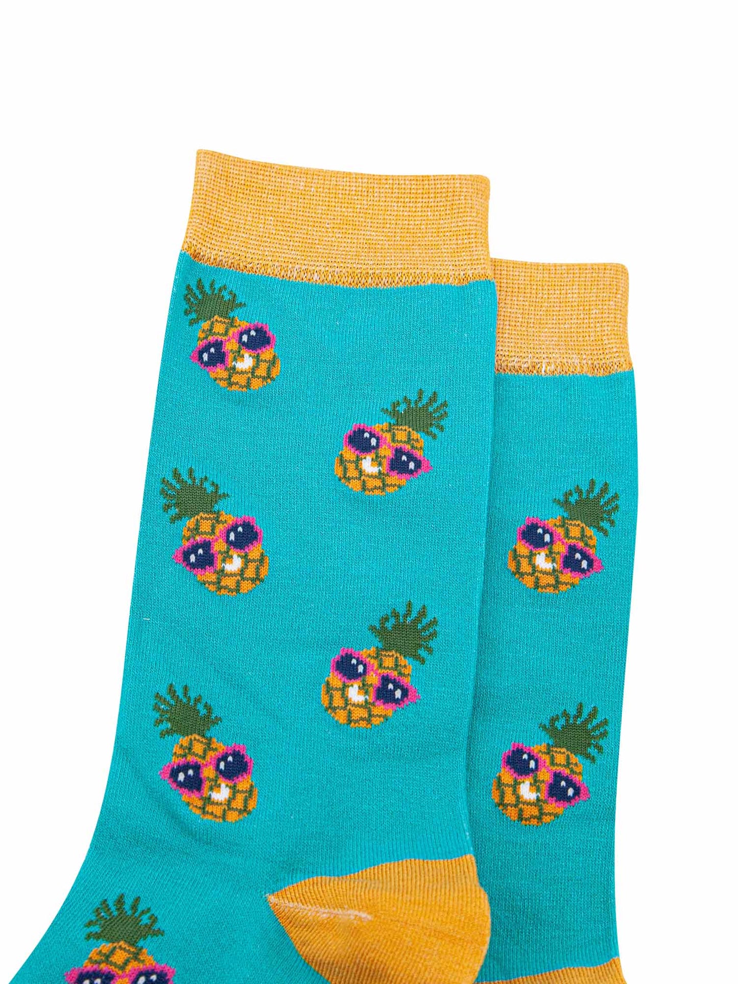 close up of the sunglass wearing pineapples on these mens bamboo socks
