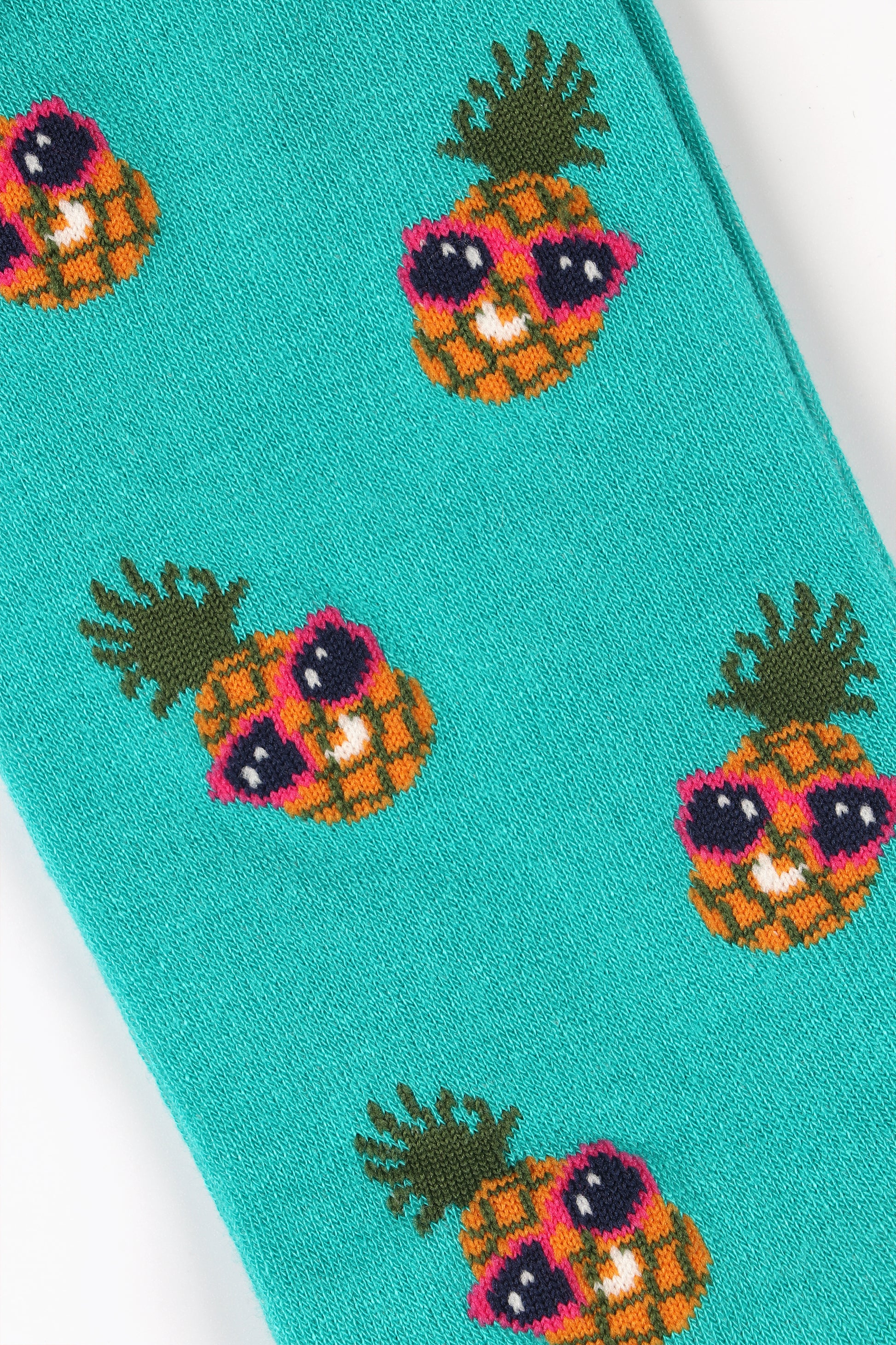 close up of the sunglass wearing pineapple print on these mens bamboo socks