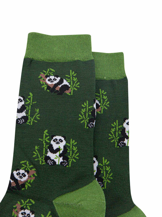 close up of the panda print, showing the giant panda relaxing in a tree and eating bamboo