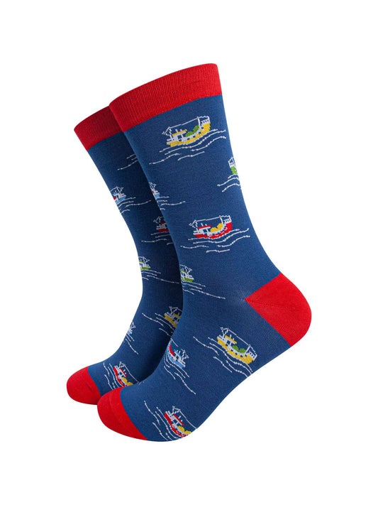 blue bamboo socks with red heel, toe and cuff with an all over pattern of colourful fishing boats at sea