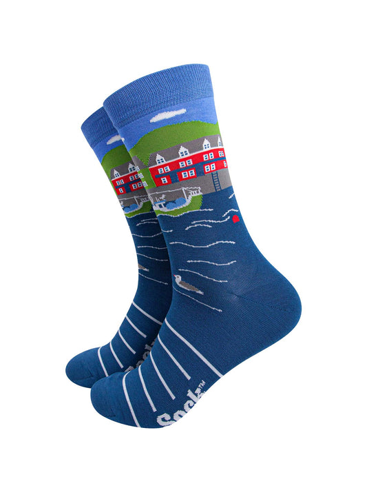 blue bamboo socks featuring a fishing village scene with seagulls, fishing boats and colourful houses in the background