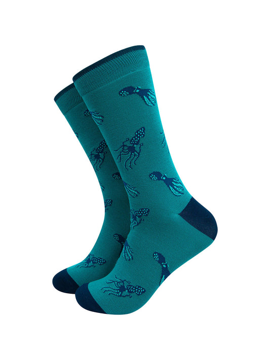 teal coloured mens bamboo dress socks with an all over blue squid and octopus print pattern