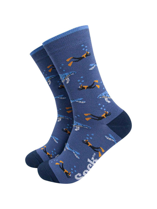 blue bamboo socks with an all over pattern of blue whales and scuba divers