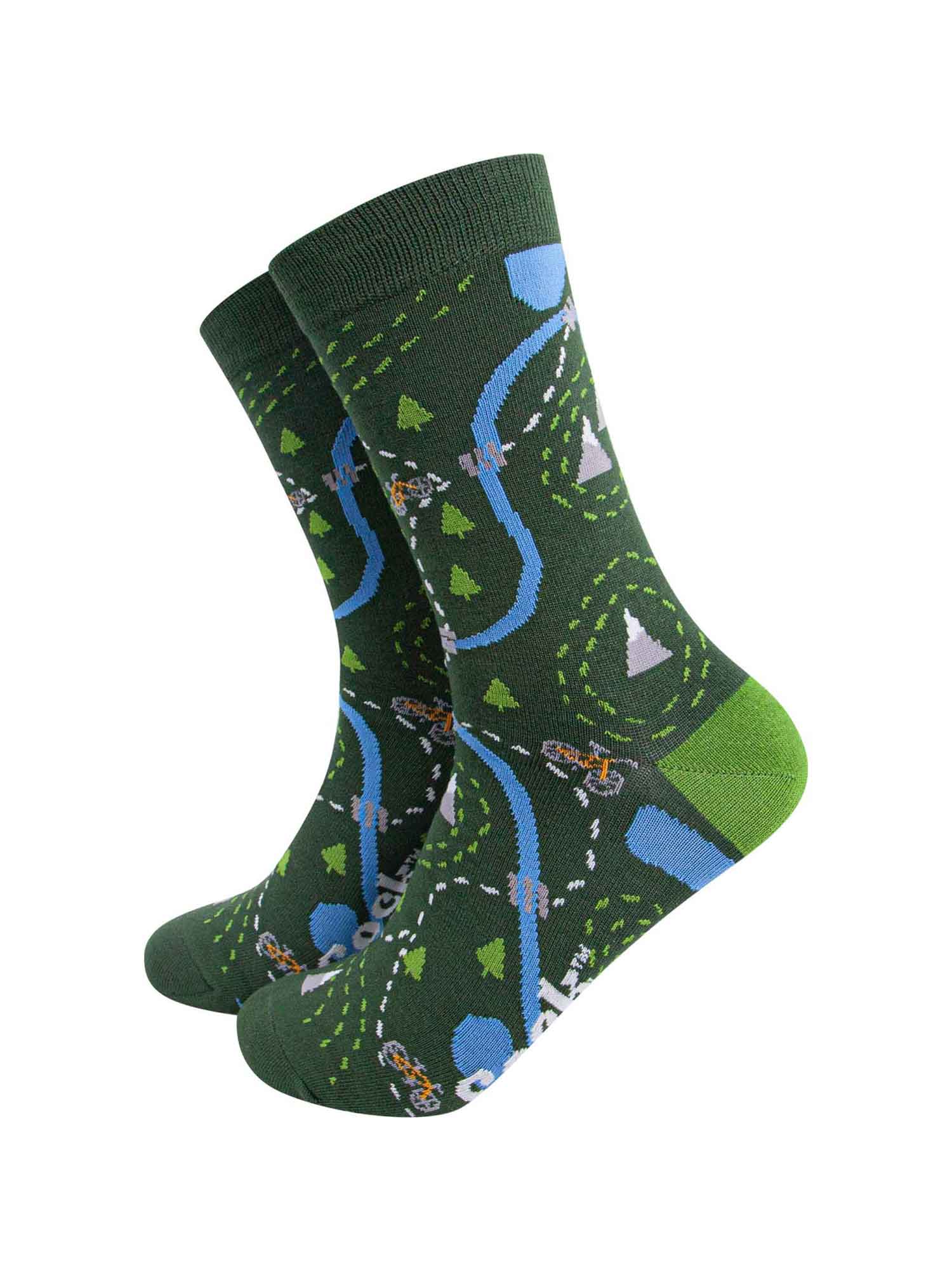 green bamboo socks designed to look like a biker route map featuring a yellow mountain bike, trees and mountains
