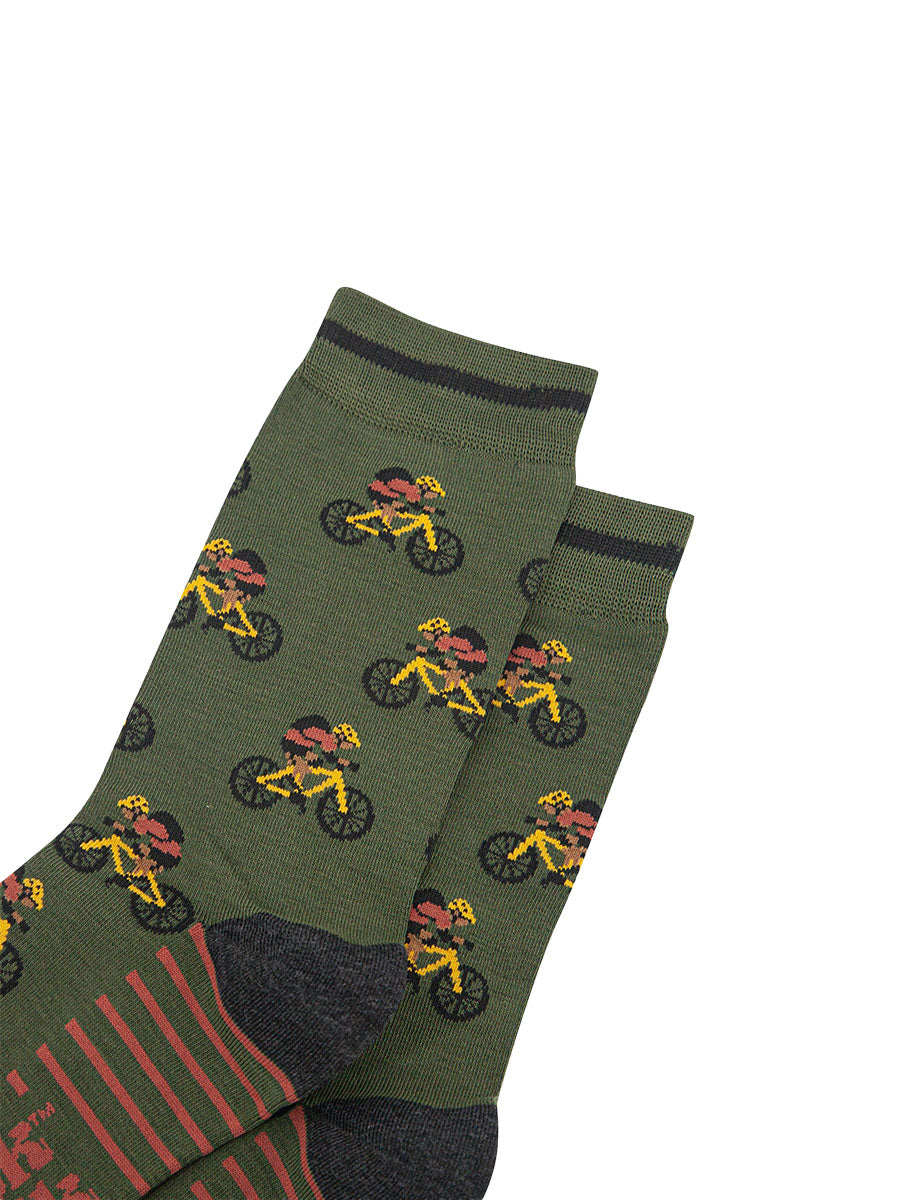 mens-bamboo-socks-khaki-mountain-bikers-close-up-cyclist-with-backpack-on-yellow-mountain-bikes