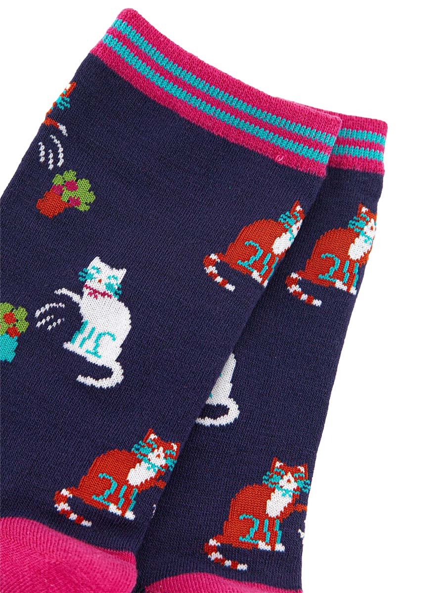 close up of the funny cat design showing white cats and ginger cats knocking over plant pots