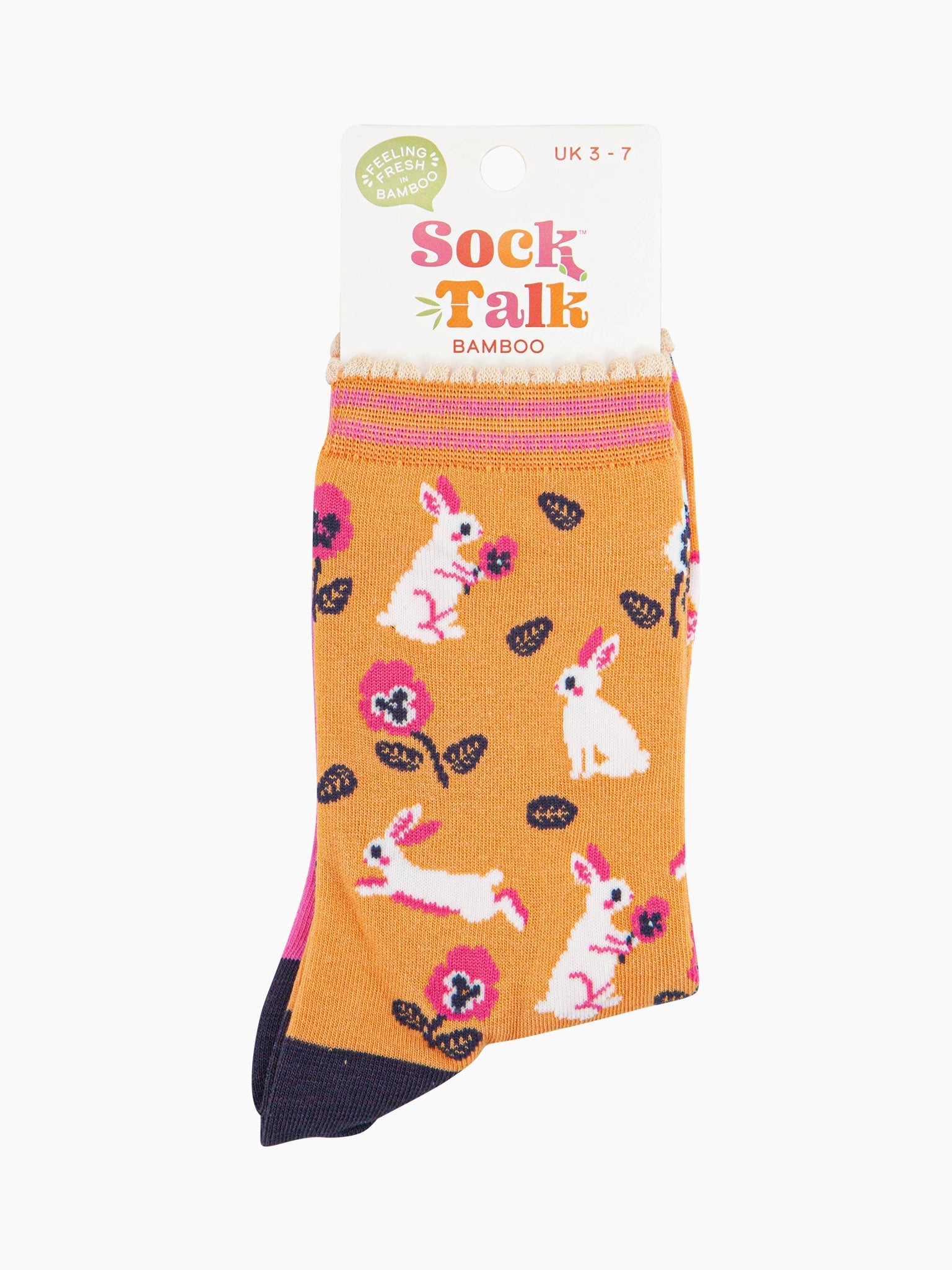 women's orange bamboo rabbit and flower socks in their sock talk packaging, the socks are a uk size 3-7.