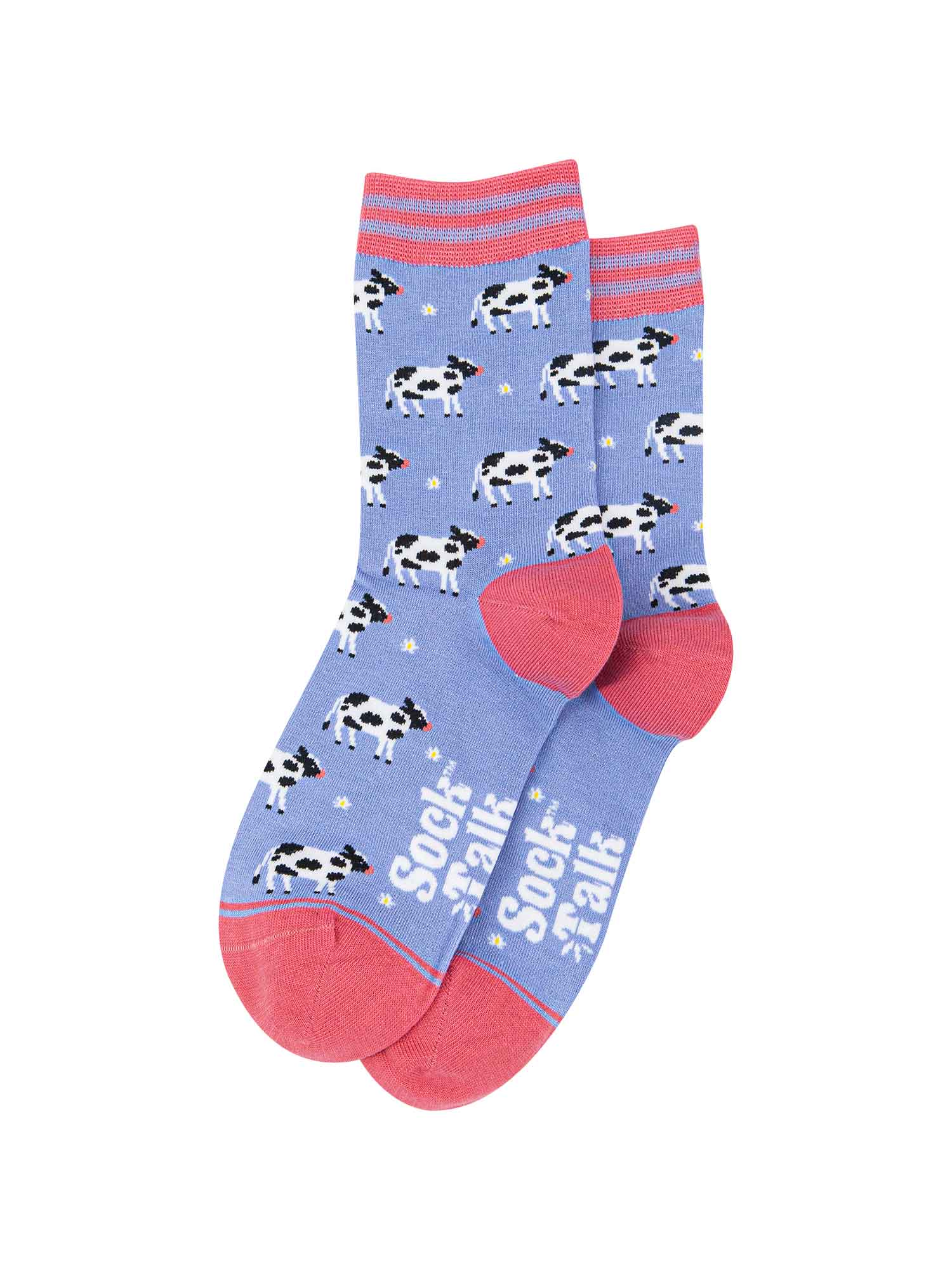 lilac bamboo socks with black and white cows all over