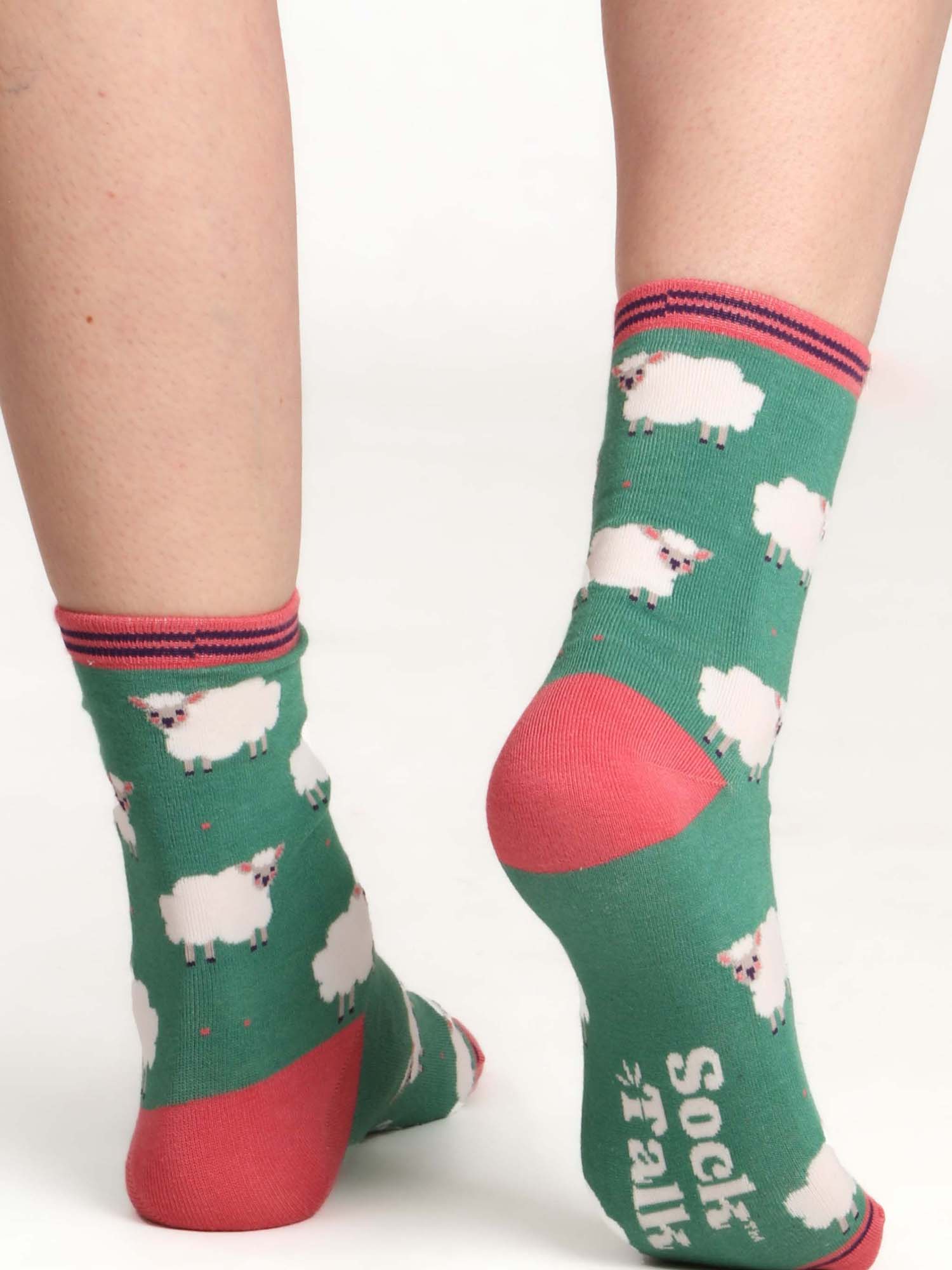 green ankle socks featuring a pattern of white woolly sheep lamb all over