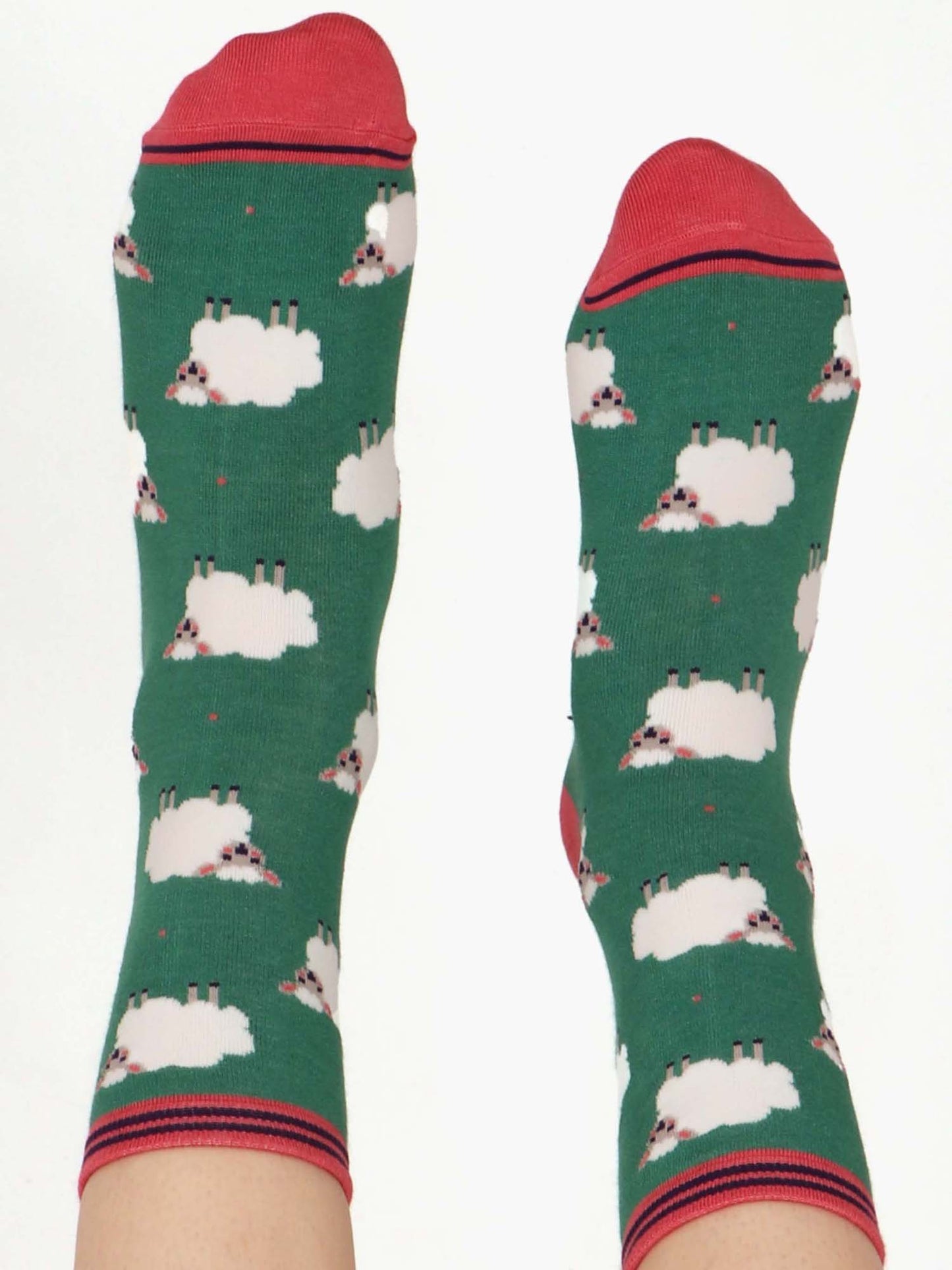 green ankle socks featuring a pattern of white woolly sheep lamb all over