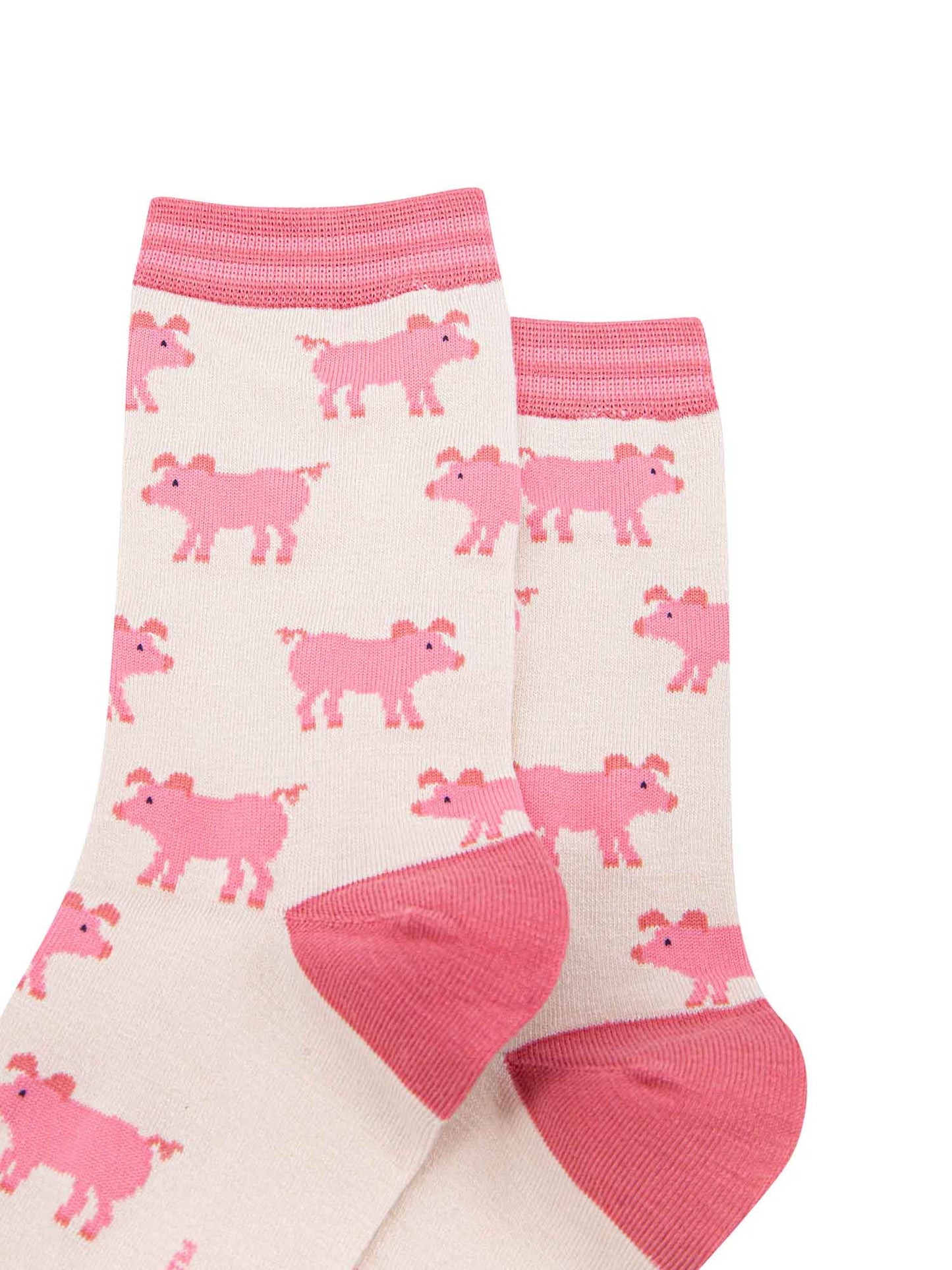 showing the cream and pink ladies pig socks laying flat, the pig pattern is all over the socks
