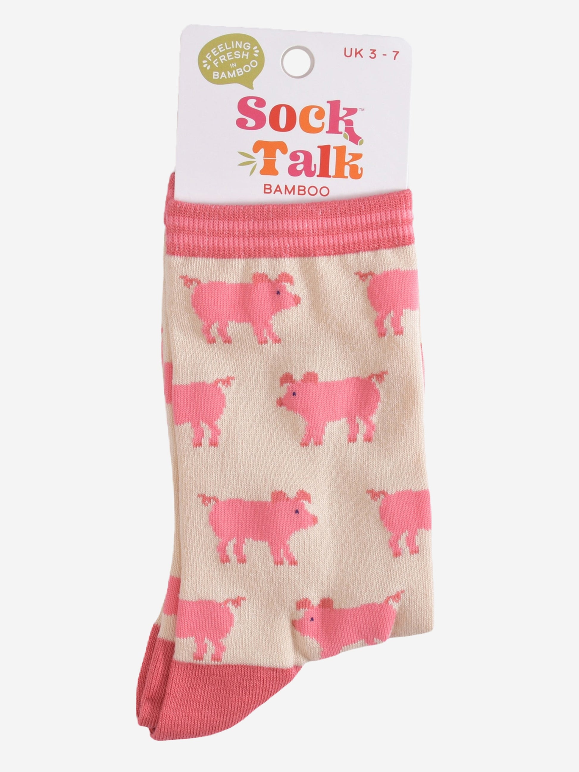 cream and pink pig bamboo socks in their sock talk packaging, these socks are a uk size 3-7