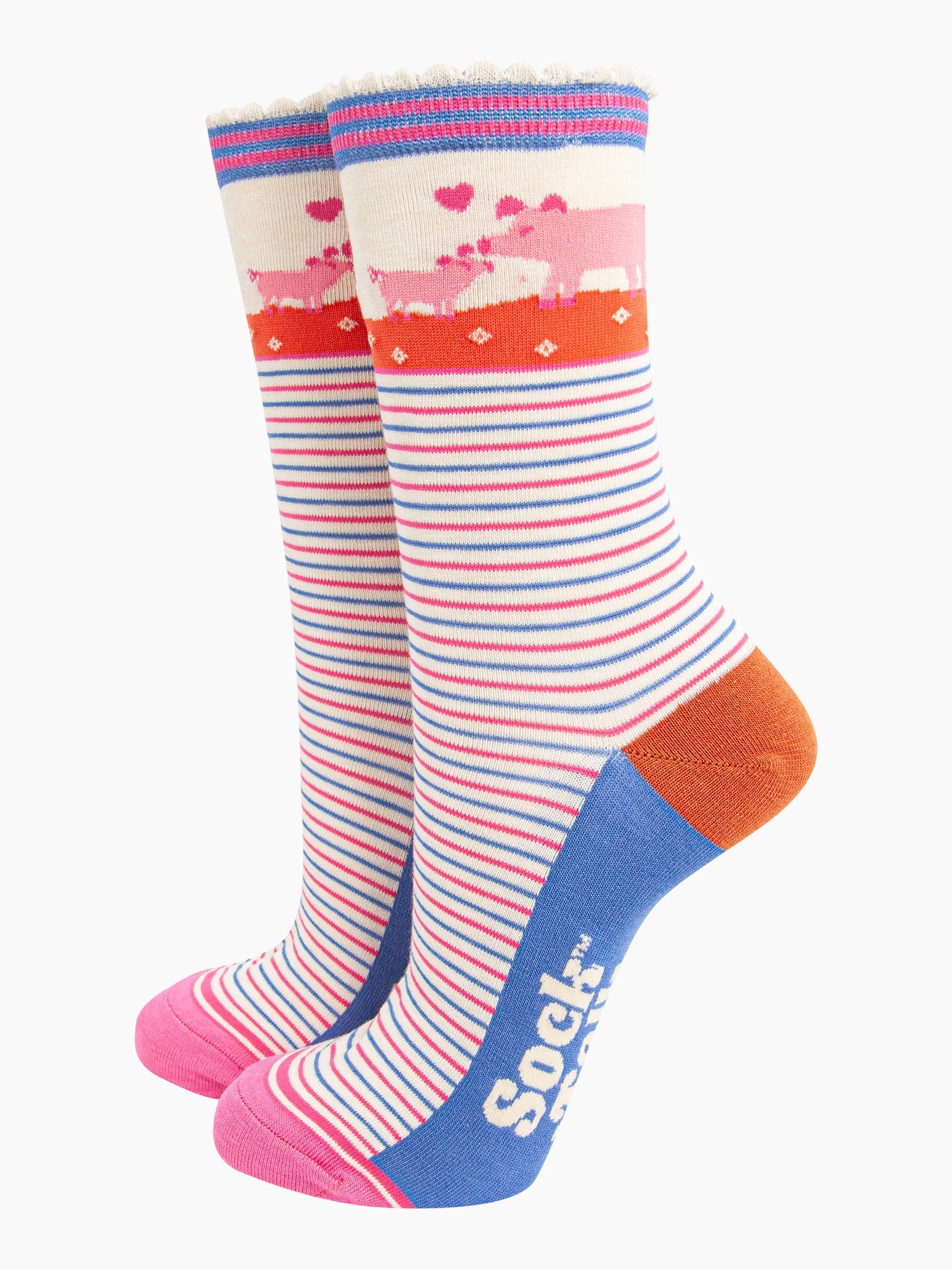 cream socks with pink and blue alternating horizontal pin stripes. the ankle features a mother pig and piglet in pink surrounded by pink love hearts