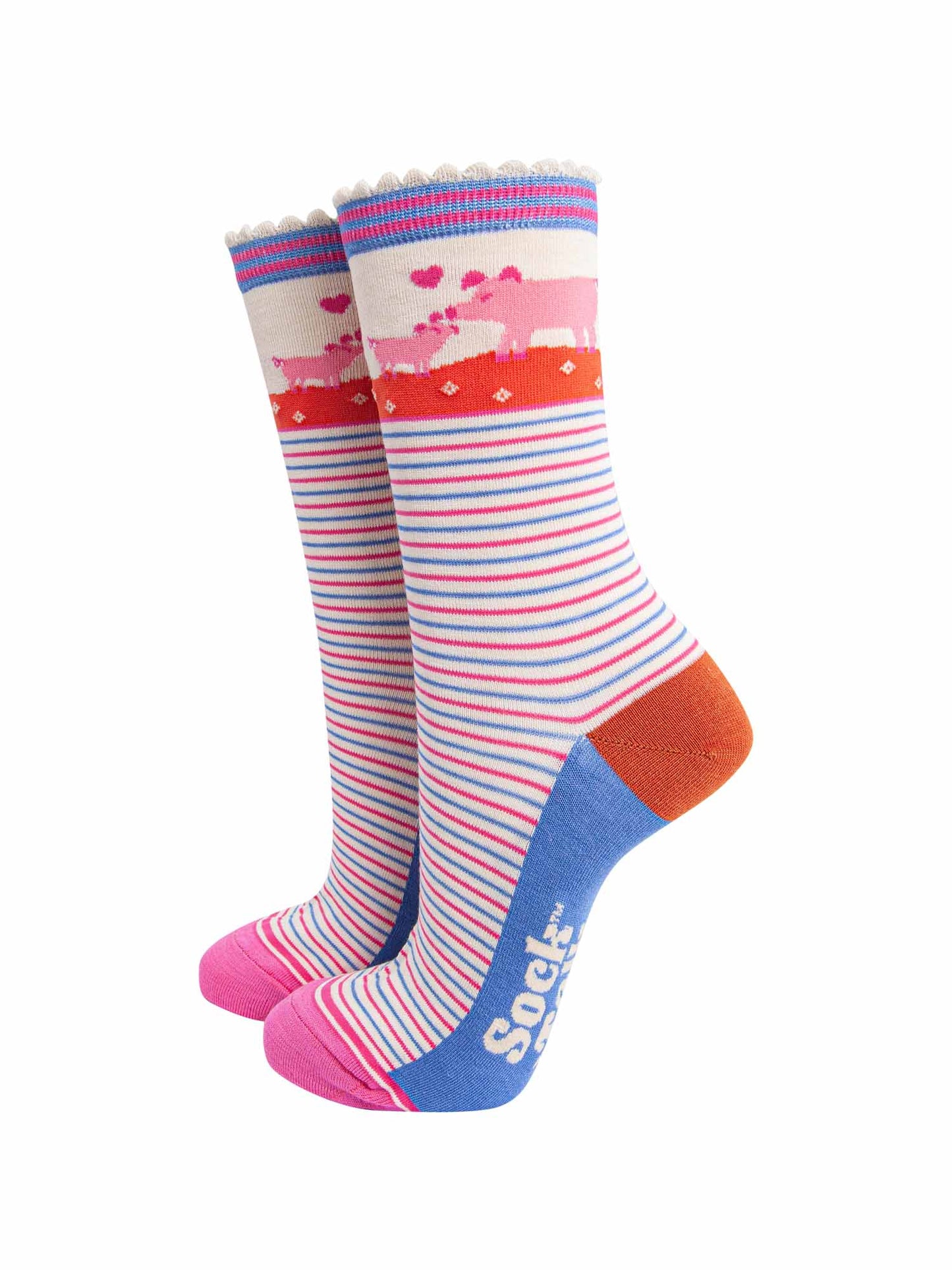 cream socks with pink and blue alternating horizontal pin stripes. the ankle features a mother pig and piglet in pink surrounded by pink love hearts