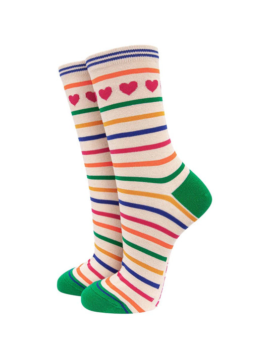 cream bamboo socks with a multicoloured rainbow stripe pattern and pink love hearts