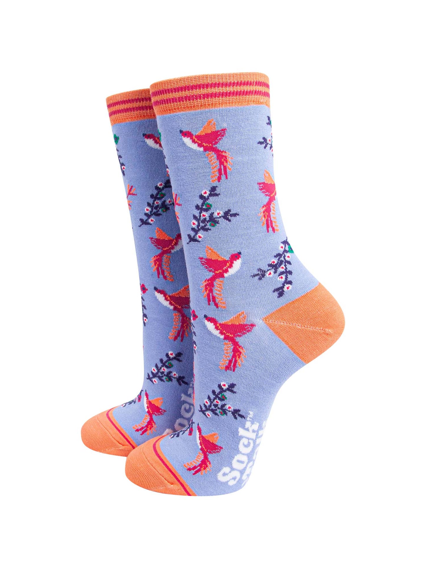 lilac blue ankle socks with orange toe and heel featuring a pattern of pink and orange hummingbirds and floral vines
