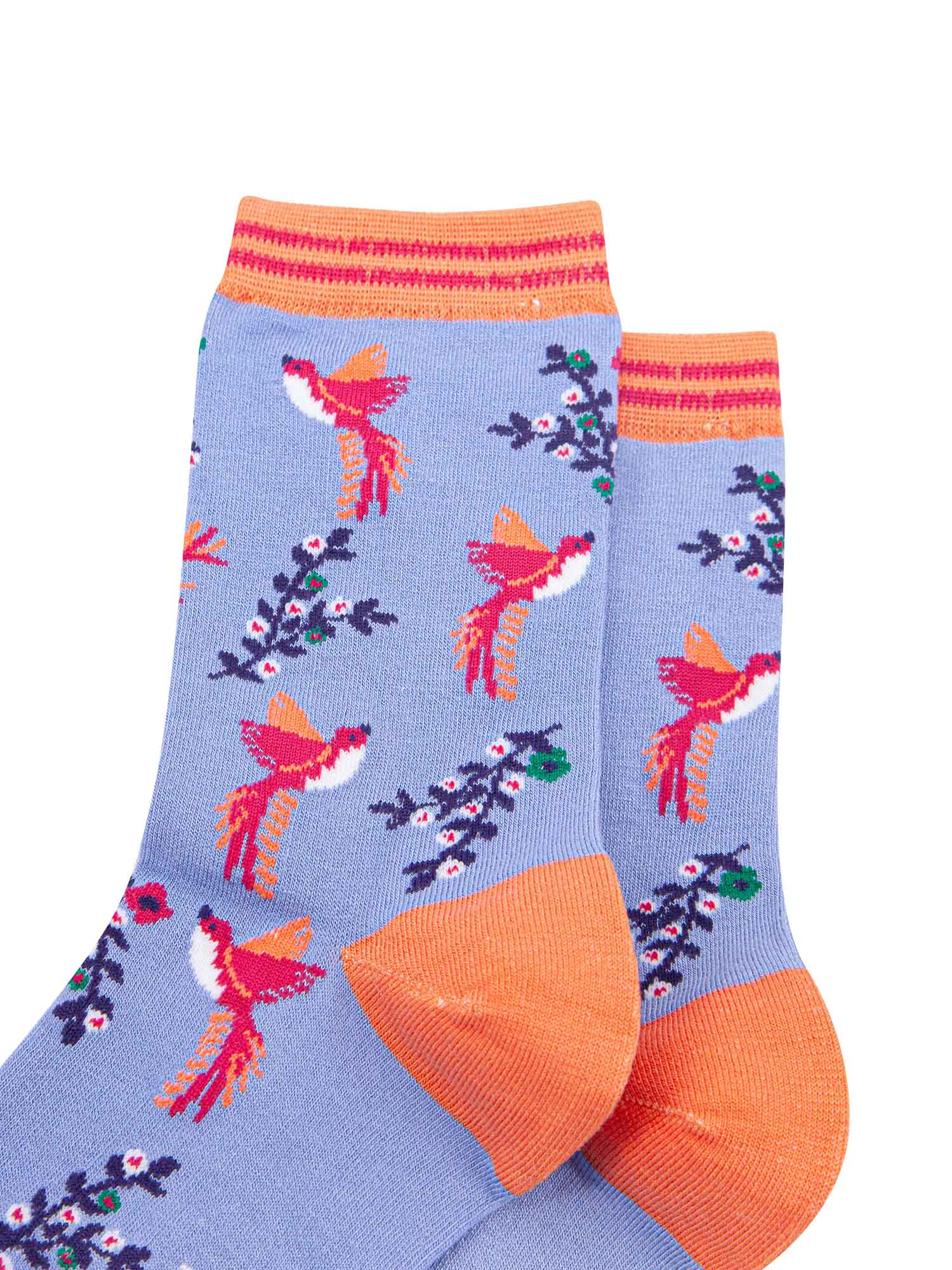 close up of the pink hummingbird print on the bamboo ankle socks, a close up of the orange and pink stiped cuff