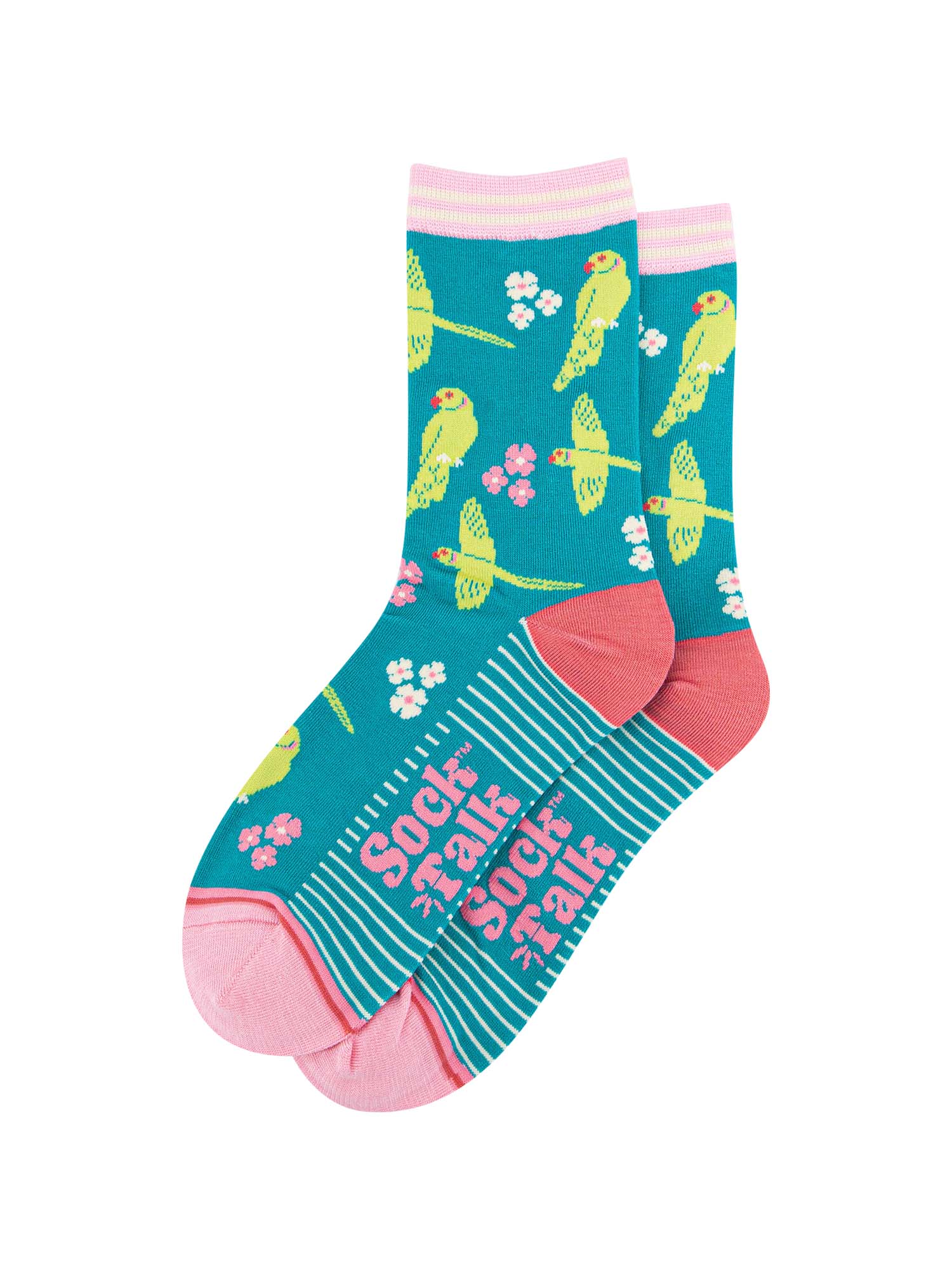 the pair of teal parakeet socks laying flat, one overlapping the other. showing clearly the teal blue background of the socks which is contrasted by the lime green parakeets and white and pink flowers. the sock talk logo is visible on the base of the sole. 