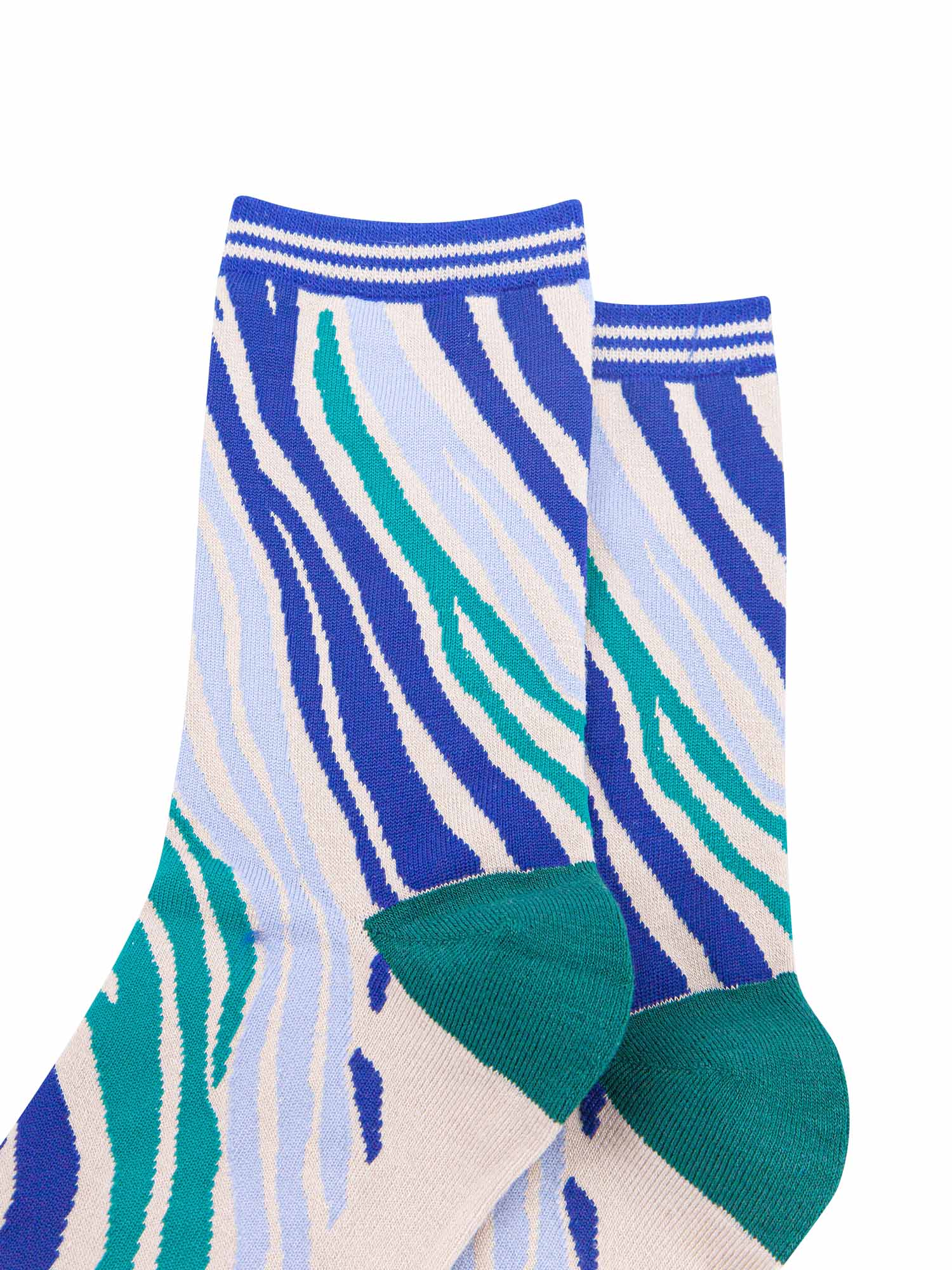 close up of the blue and green zebra print design