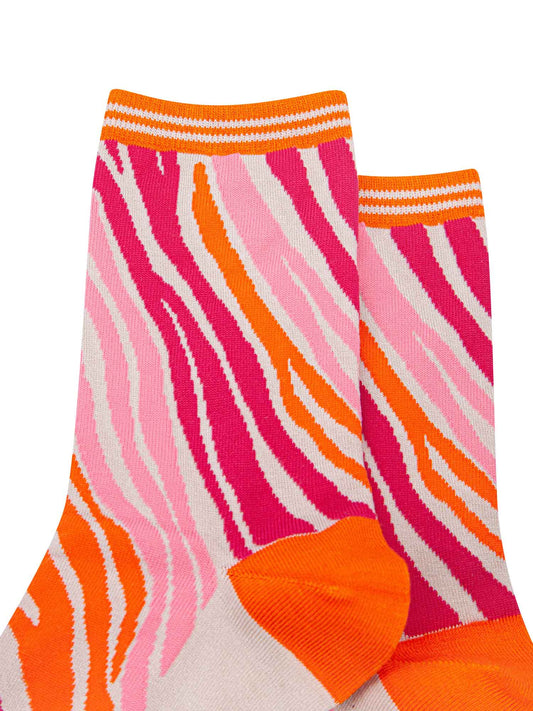 close up of the pink and orange zebra print pattern on the ankle socks
