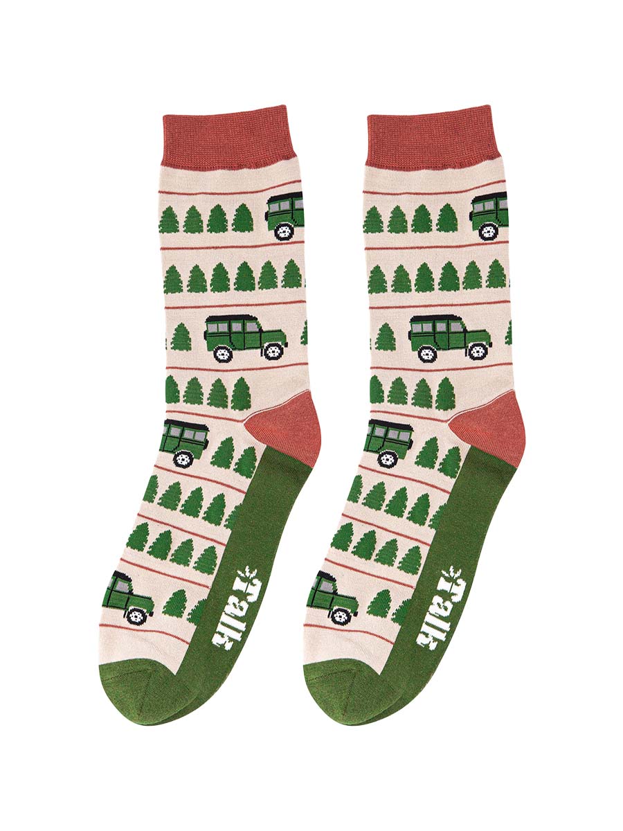 cream, green and orange socks with a pattern of trees and off road vehicles 