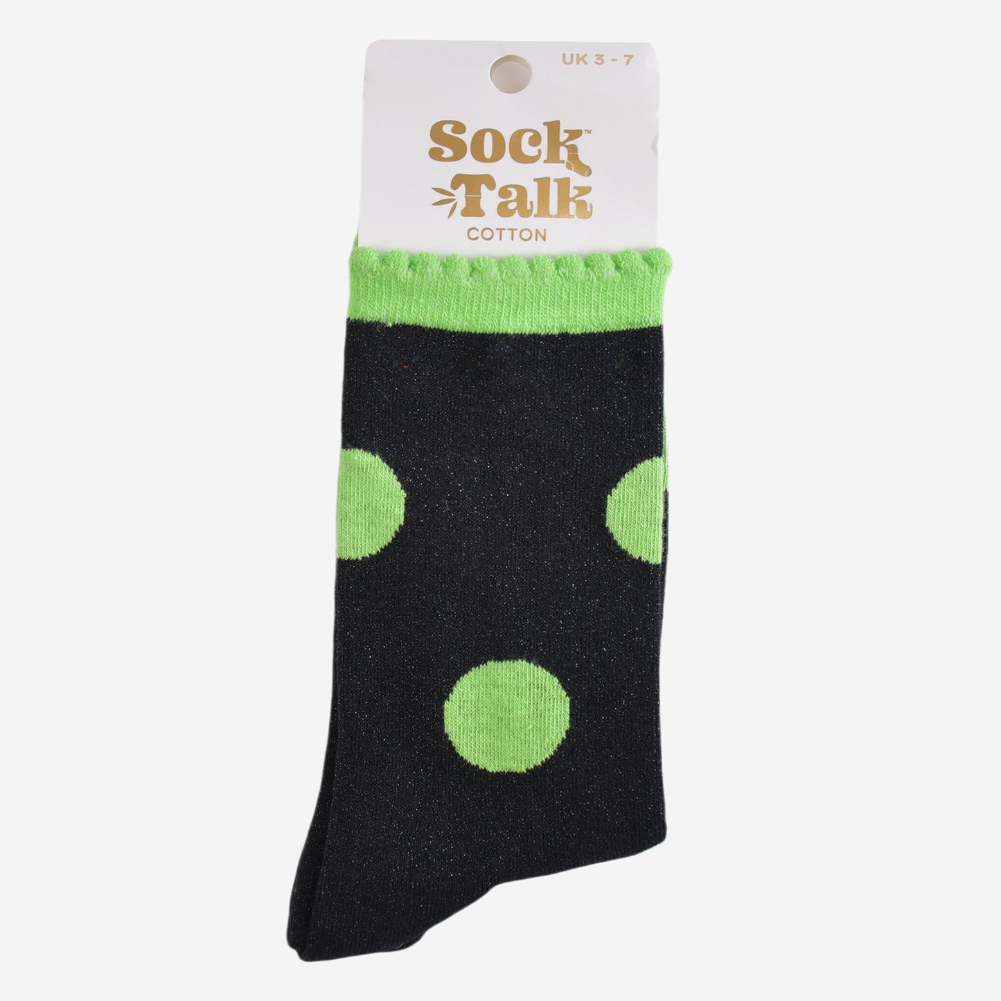 black and lime green polka dot glitter socks in their sock talk packaging, these socks are a uk size 3-7