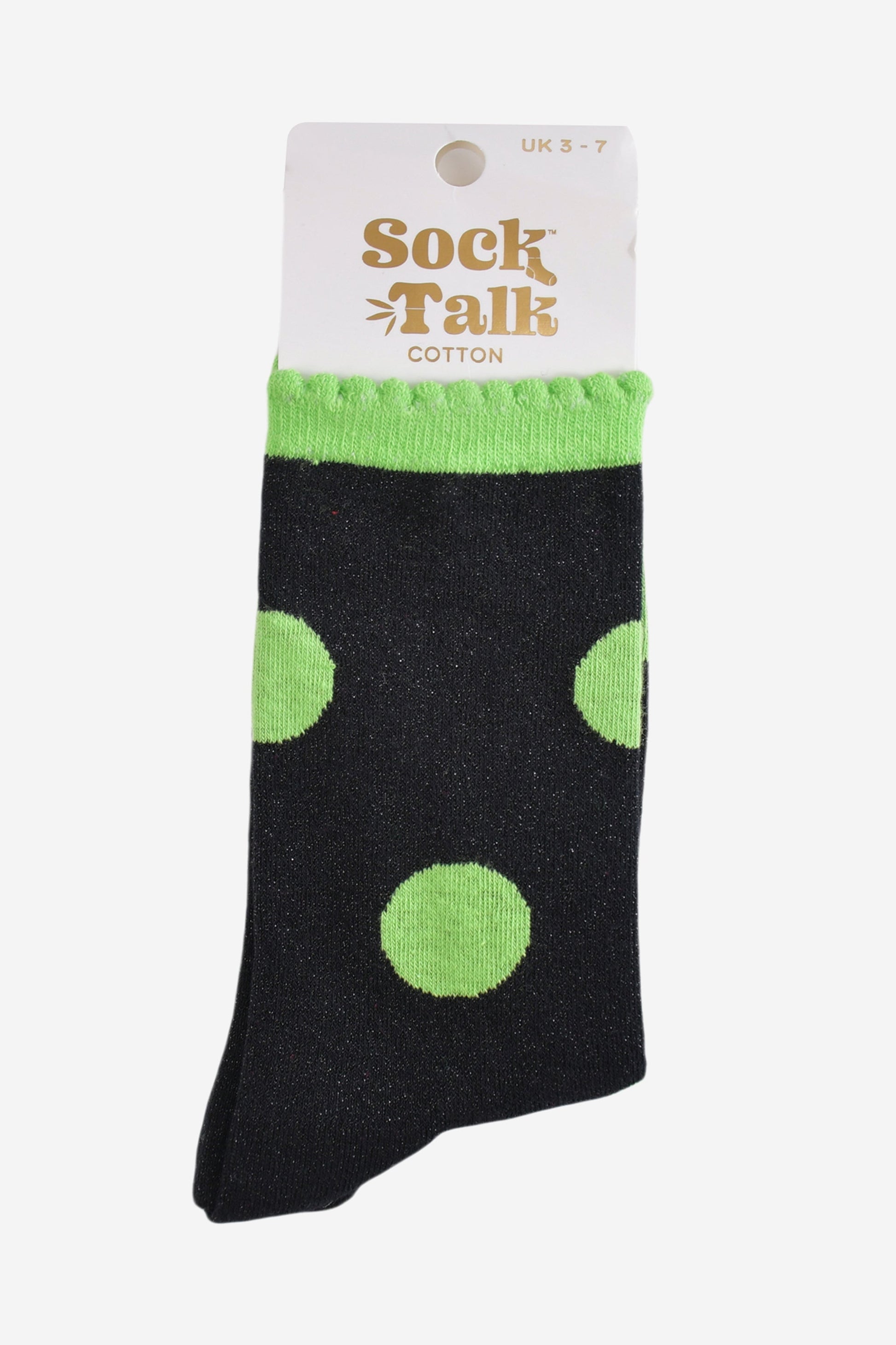 black and lime green polka dot glitter socks in their sock talk packaging, these socks are a uk size 3-7