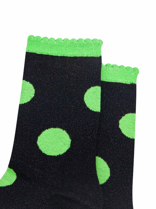 close up of the silver glitter sparkle of the ankle socks, also showing clearly the scalloped cuff