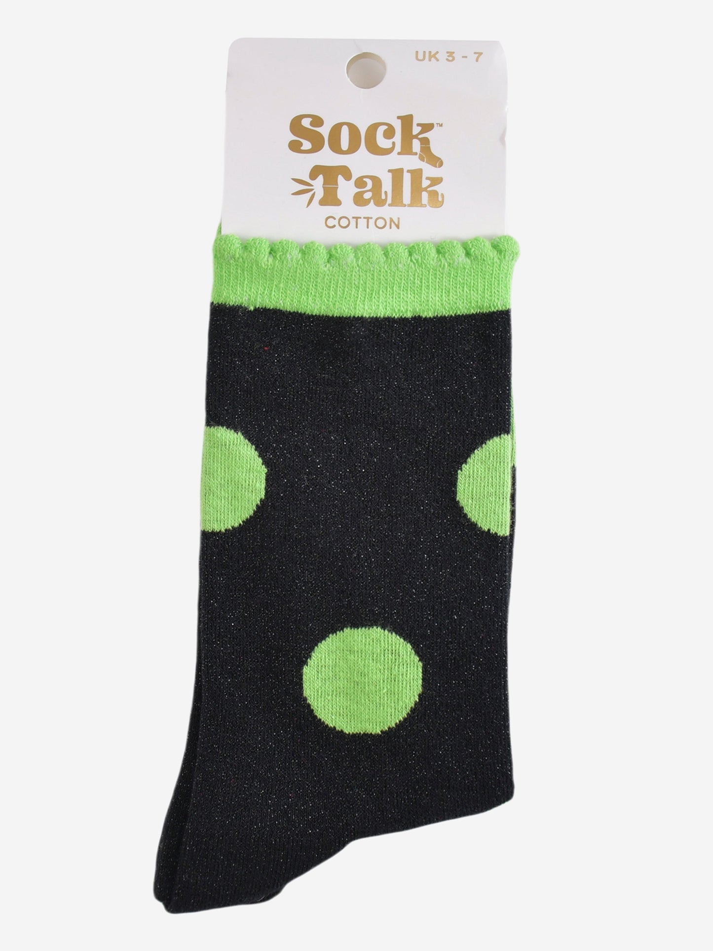 black and lime green polka dot glitter socks in their sock talk packaging, these socks are a uk size 3-7