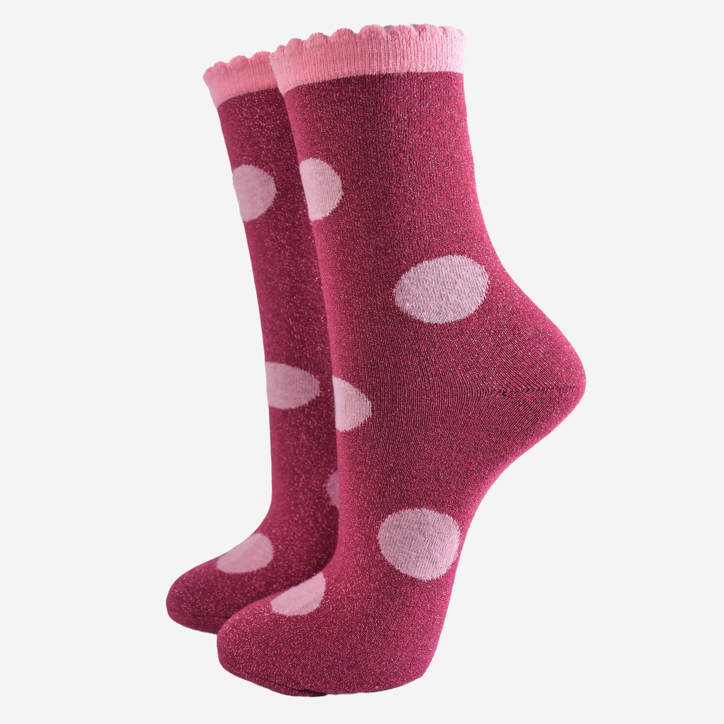 berry red socks with a large light pink polka dot pattern and scalloped cuff